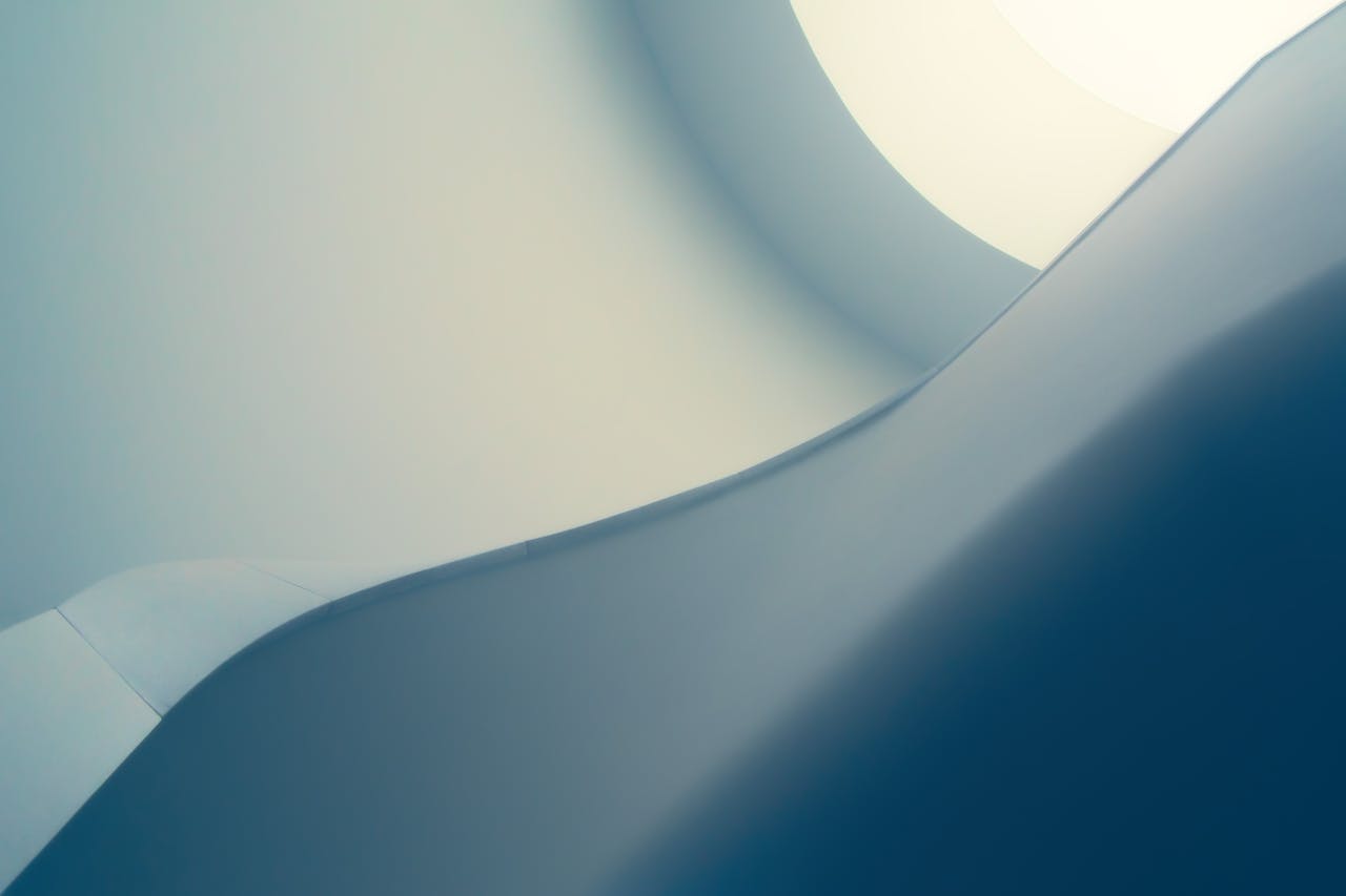 Sophisticated minimalist abstract with smooth blue curves and geometric design, perfect for a modern background.